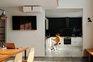 Woman in Wheelchair in Kitchen